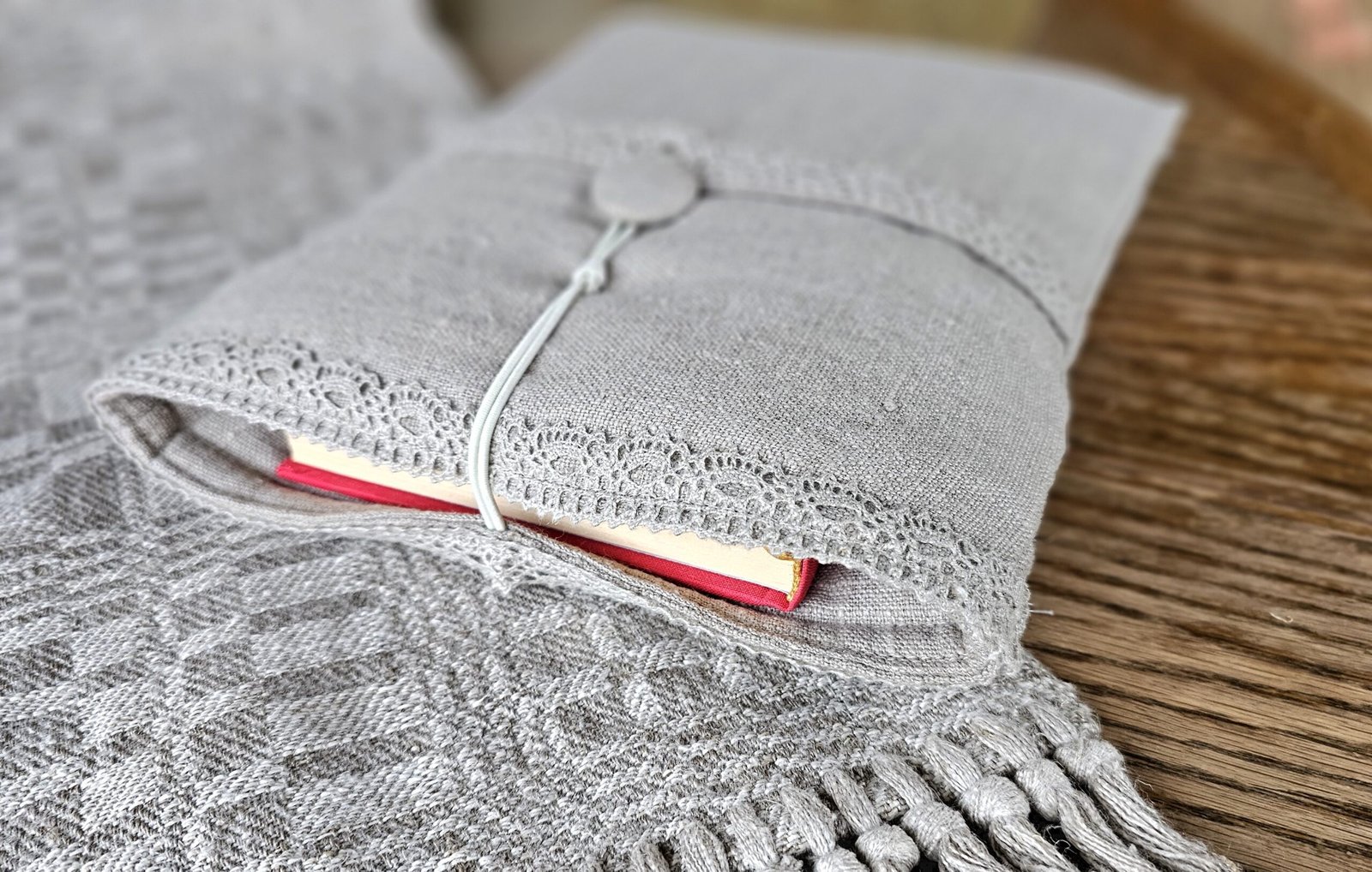 Raw linen book sleeve with lace