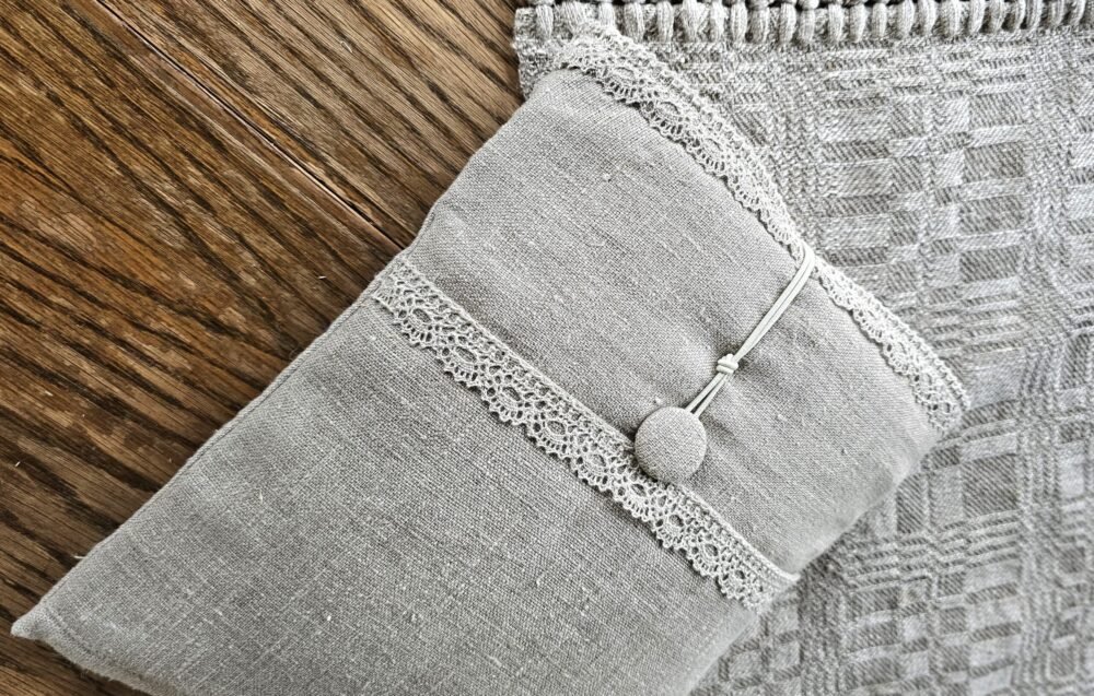 Raw linen book sleeve with lace
